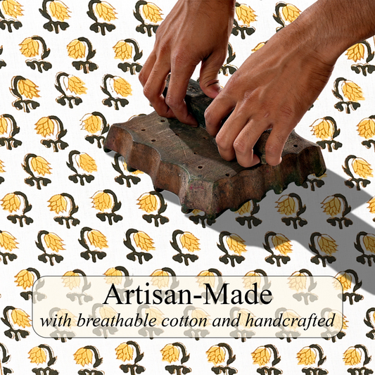 Hands using a wooden stamp on a patterned background with 'Artisan-Made' text.
