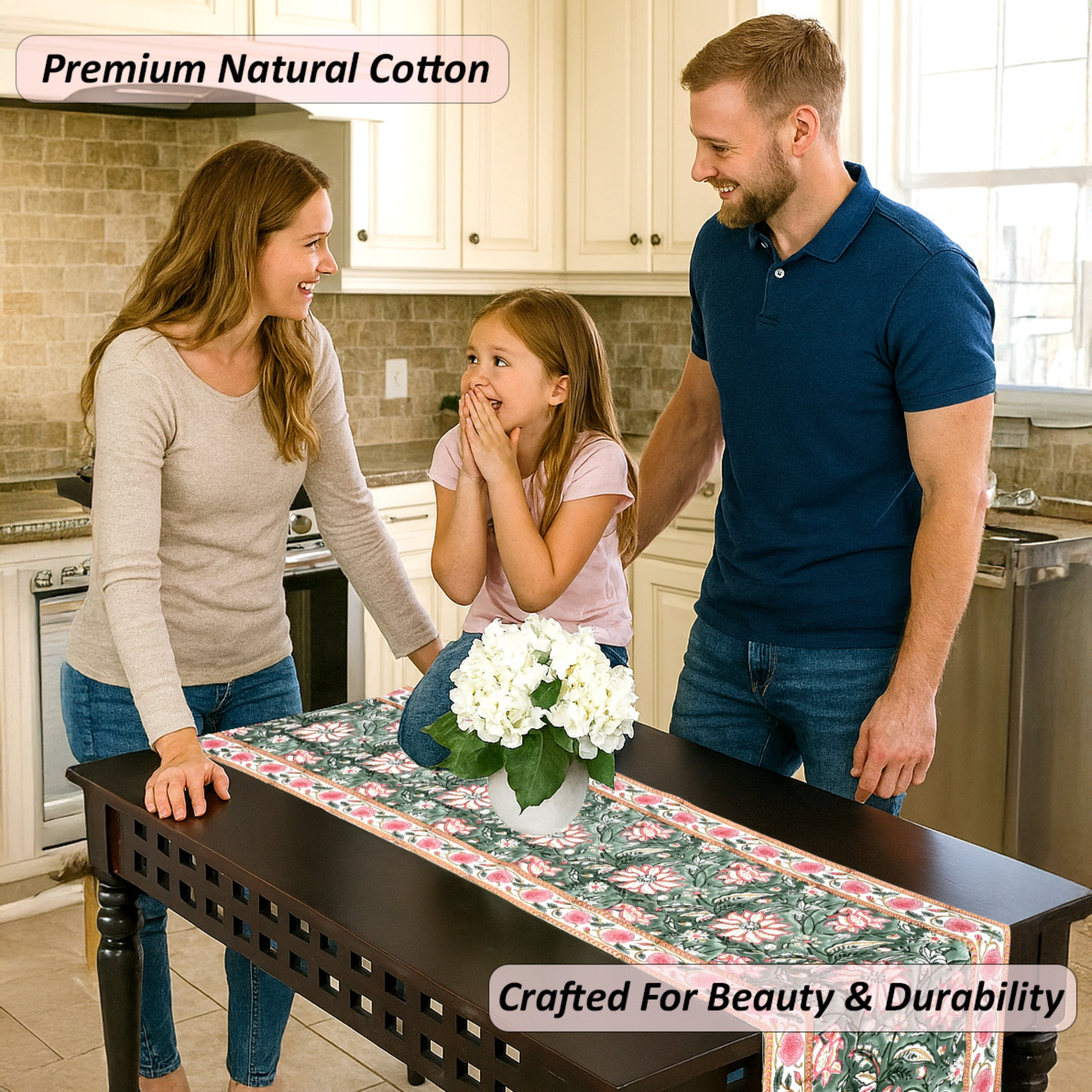 Family in a kitchen with a table runner featuring white flowers.