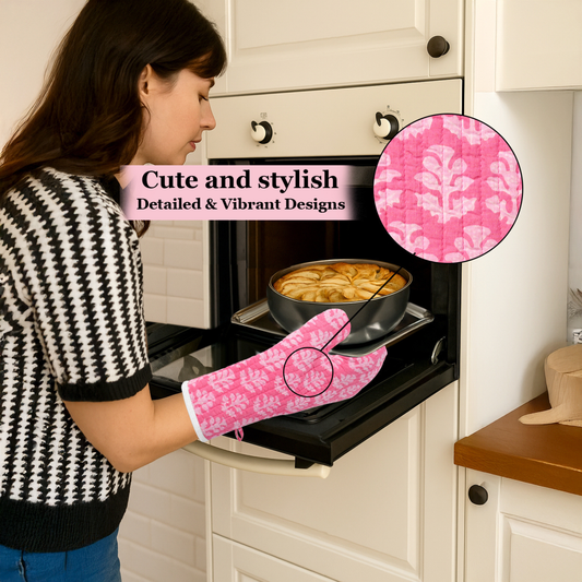Woman wearing a pink oven mitt with floral pattern, opening an oven door.