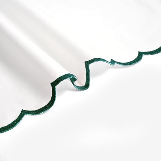 Green decorative trim on a white background
