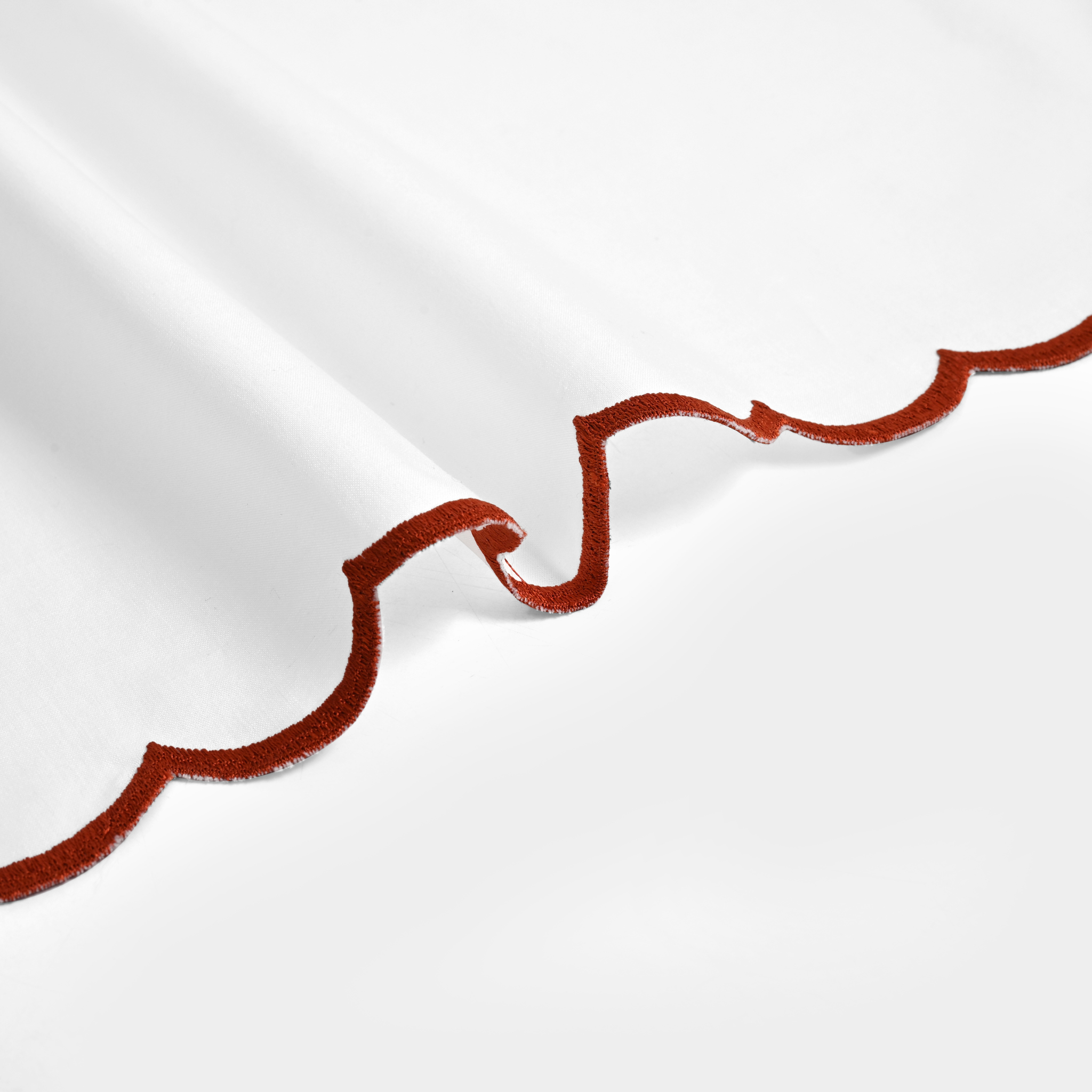 Close-up of red velvet trim on a white background