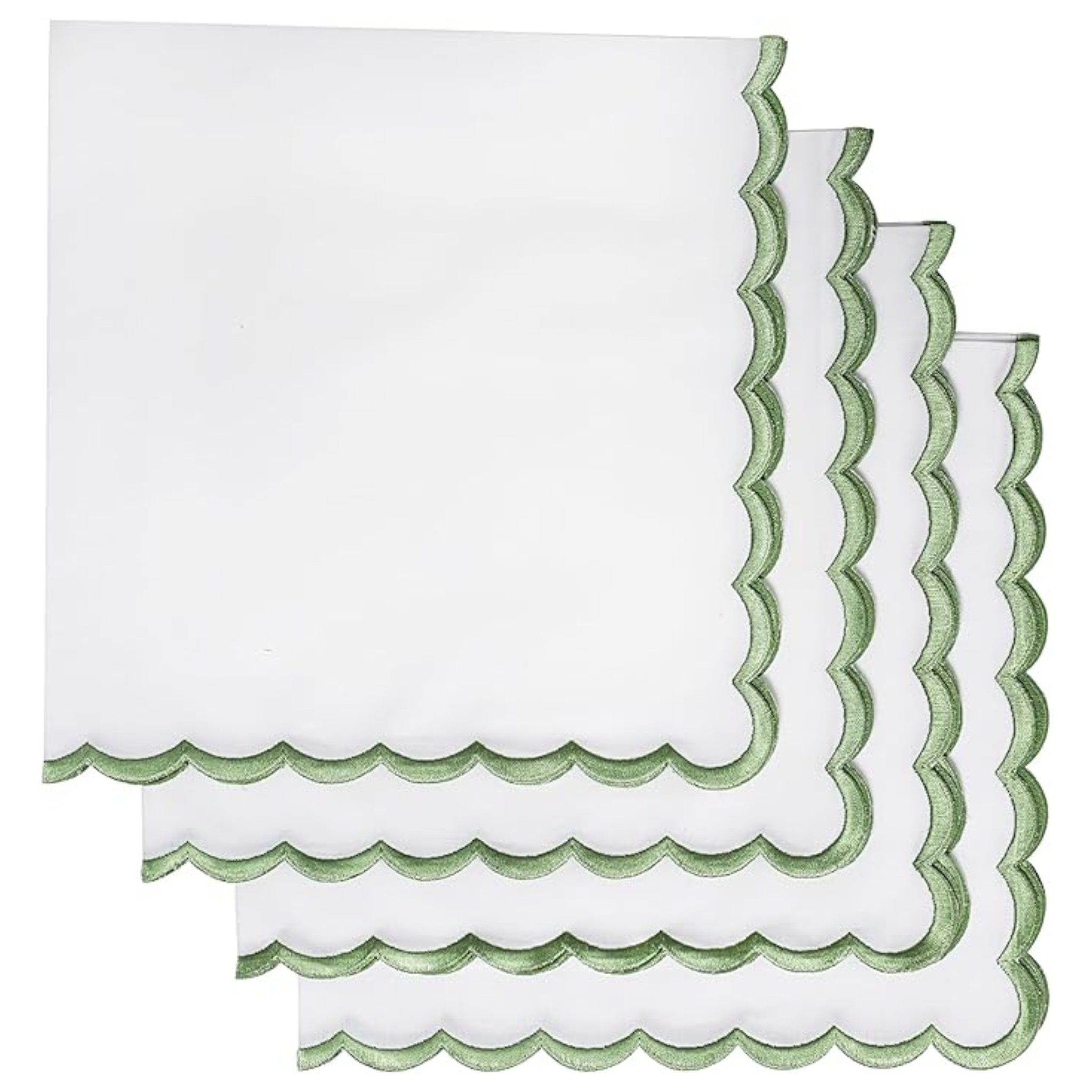 Set of white napkins with green scalloped edges on a white background